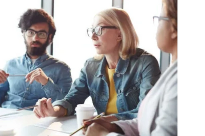 Two professionals in a focused one-on-one mentorship session
